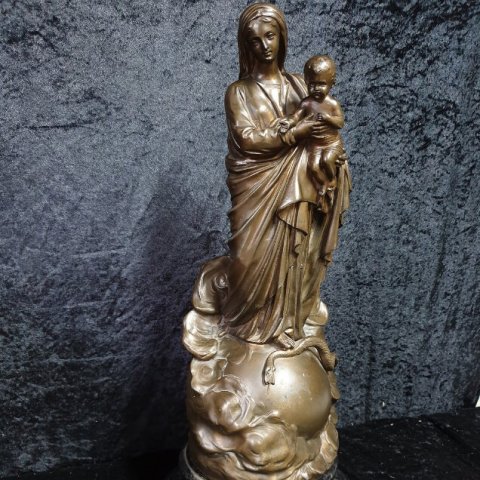 virgin mary statue with snake