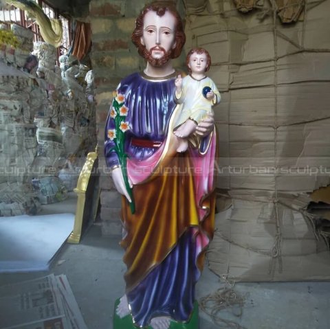joseph holding jesus sculpture