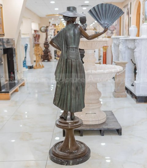 lady with fan statue