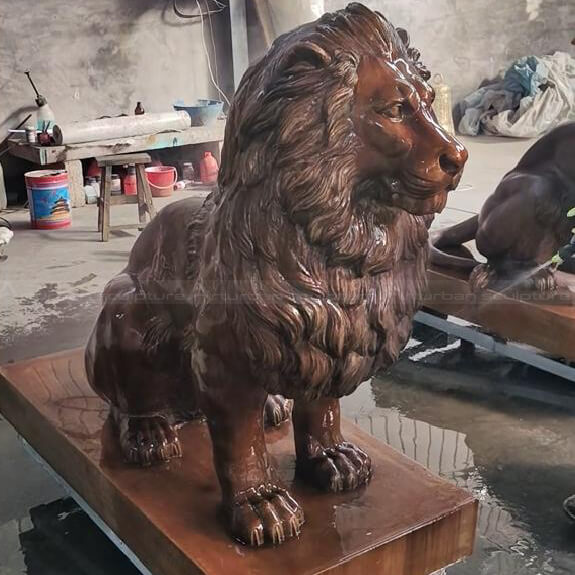 bronze sitting lion statue